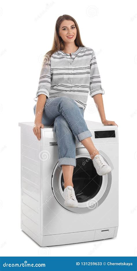 woman sitting on washing machine